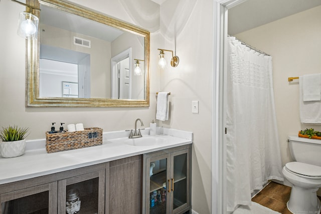 bathroom with vanity, toilet, wood-type flooring, and a shower with shower curtain