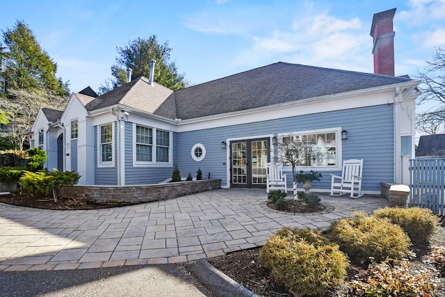 back of property featuring a patio area and french doors