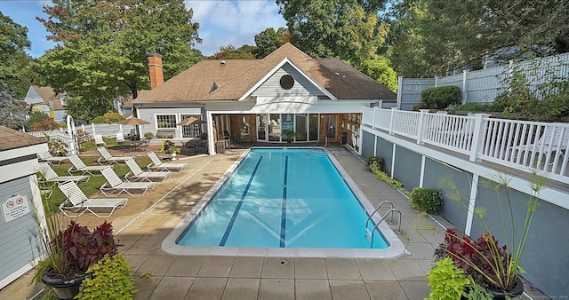 view of swimming pool with a patio area