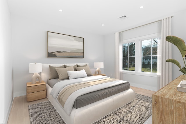 bedroom with light wood-type flooring