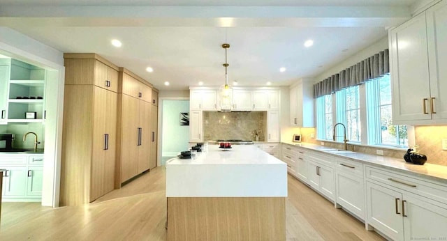 kitchen featuring white cabinetry and a kitchen island