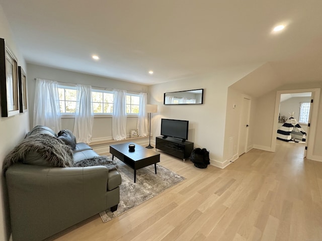 living room with light hardwood / wood-style flooring