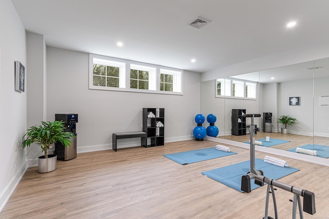 exercise area featuring light wood-type flooring