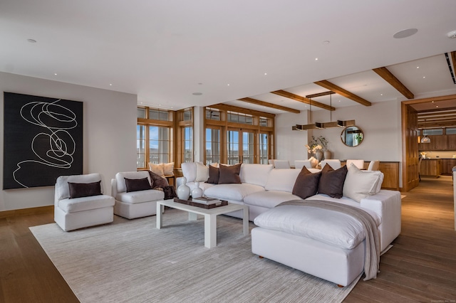 living room with beam ceiling and light hardwood / wood-style floors