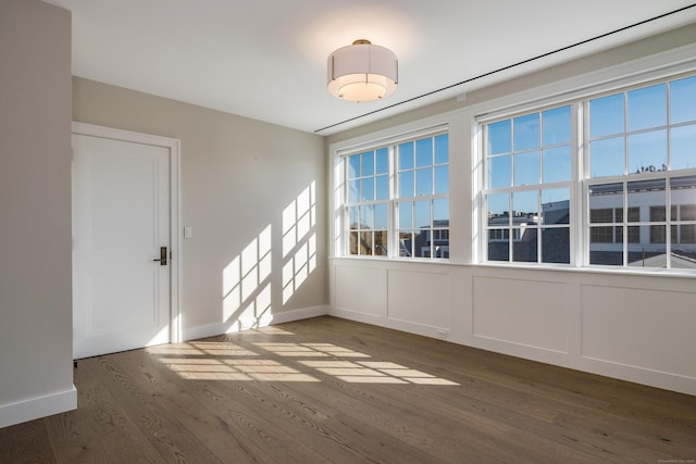 spare room featuring dark hardwood / wood-style flooring