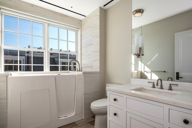 bathroom featuring vanity and toilet