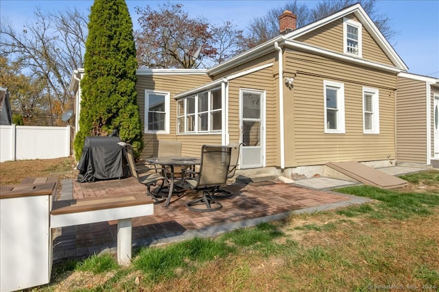 rear view of house featuring a patio