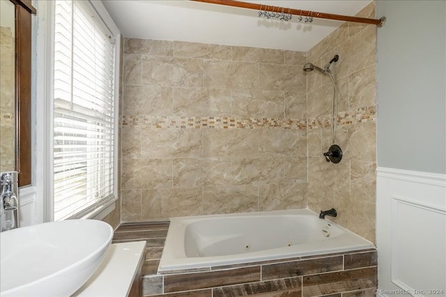 bathroom featuring vanity and tiled shower / bath combo