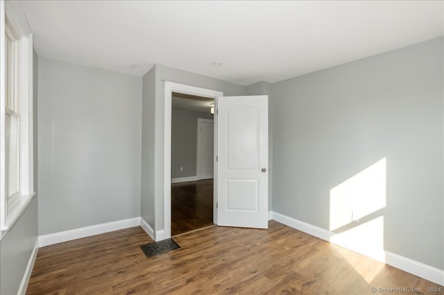 unfurnished room featuring wood-type flooring