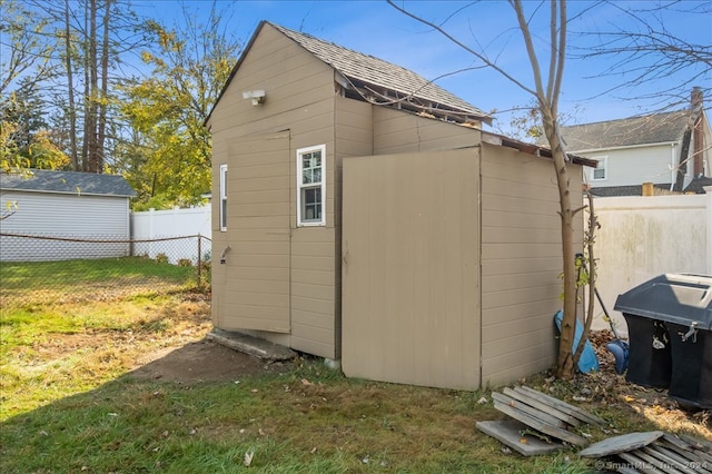 view of outbuilding featuring a lawn