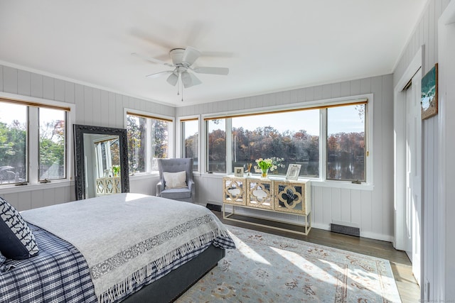 bedroom with ceiling fan and dark hardwood / wood-style floors