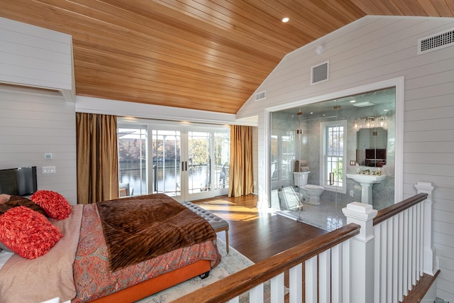 bedroom featuring hardwood / wood-style floors, wood walls, wood ceiling, and vaulted ceiling