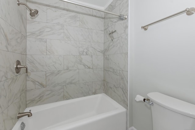 bathroom with shower / bathing tub combination and toilet