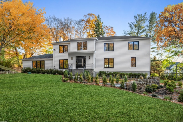 view of front of property with a front lawn