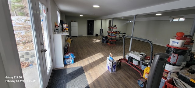 exercise room with french doors and dark hardwood / wood-style floors