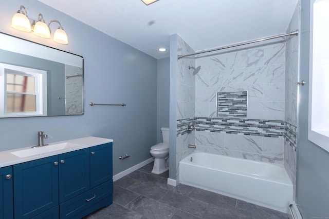 bathroom featuring baseboards, toilet, vanity, baseboard heating, and shower / bathtub combination