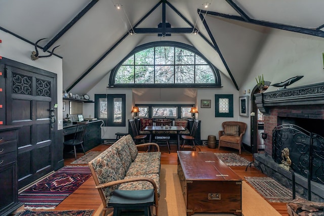 51 Wykeham Rd, Washington, CT 06793 - living room with high vaulted ceiling, wood finished floors, a brick fireplace, and beamed ceiling