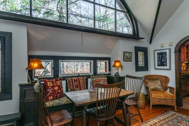 51 Wykeham Rd, Washington, CT 06793 - dining area featuring wood finished floors, high vaulted ceiling, and arched walkways