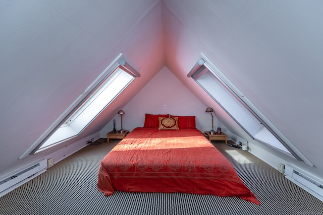 carpeted bedroom featuring vaulted ceiling with skylight