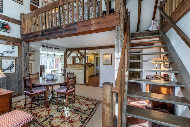 dining room featuring a towering ceiling