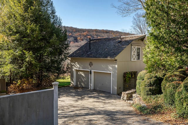 view of side of home with a garage