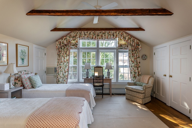 bedroom with vaulted ceiling with beams, ceiling fan, wood-type flooring, and a baseboard heating unit