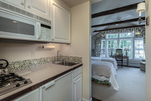 kitchen featuring carpet flooring, ceiling fan, sink, gas stovetop, and white cabinets