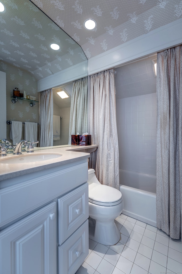 full bathroom featuring toilet, tile patterned flooring, vanity, and shower / tub combo with curtain