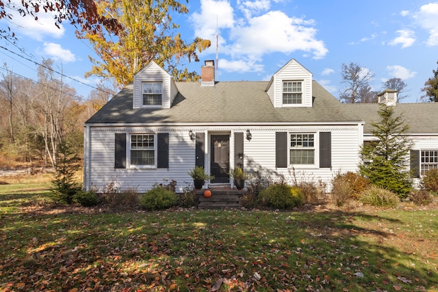 cape cod-style house with a front lawn