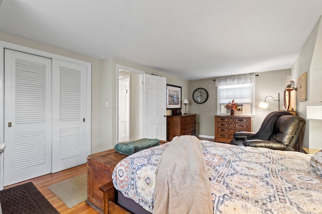 bedroom with a closet and light wood-type flooring