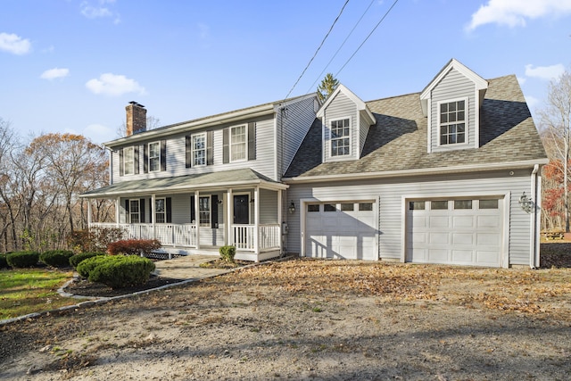 view of front of house with a porch and a garage