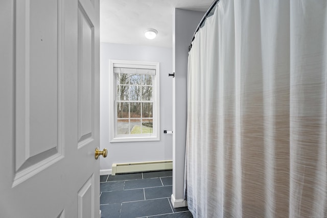 bathroom featuring tile patterned flooring and a baseboard radiator