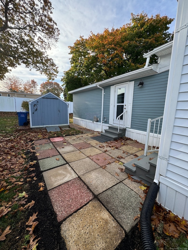 view of patio / terrace featuring a storage unit