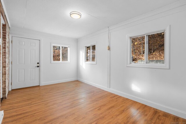 unfurnished room featuring light hardwood / wood-style floors