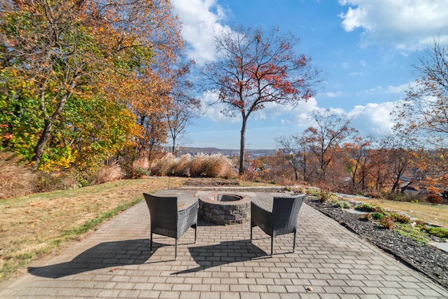 view of patio featuring an outdoor fire pit