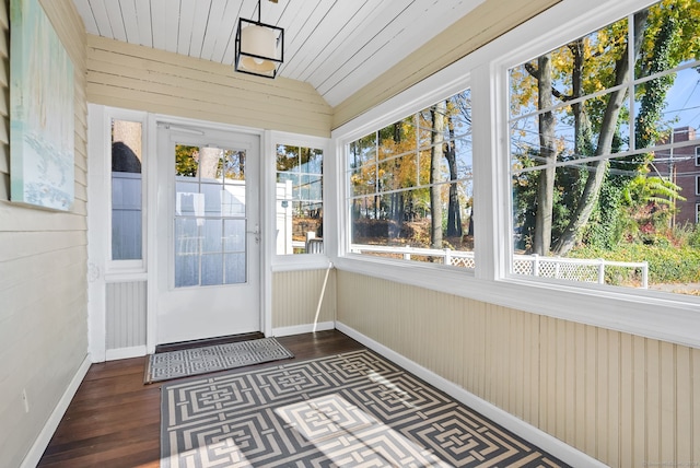 unfurnished sunroom featuring vaulted ceiling