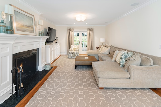 living room featuring wood-type flooring and ornamental molding