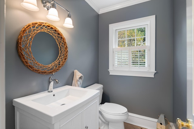 bathroom with tile patterned floors, vanity, toilet, and crown molding