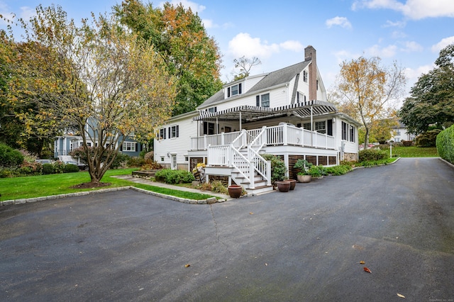 view of front of home with a deck