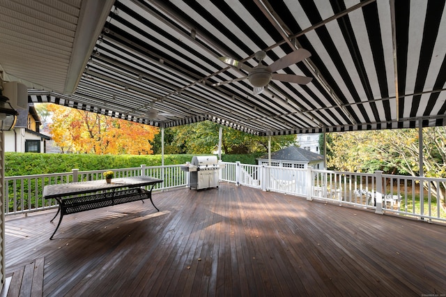 deck featuring a grill and ceiling fan