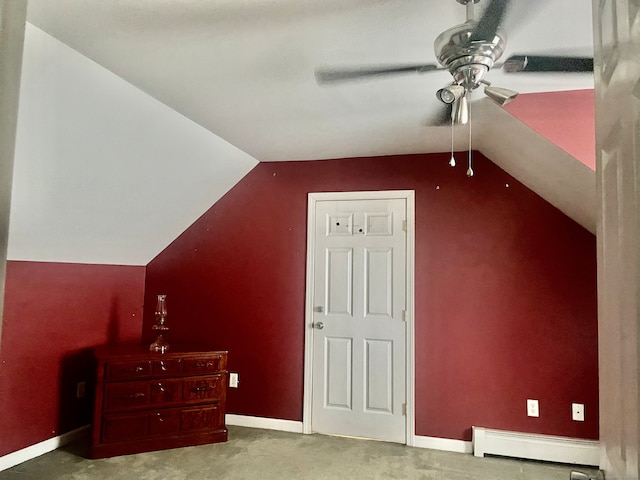 bonus room featuring ceiling fan, lofted ceiling, and a baseboard radiator