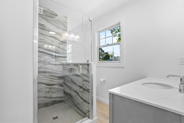 bathroom featuring vanity and an enclosed shower