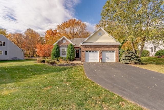 view of front of home featuring a garage and a front yard