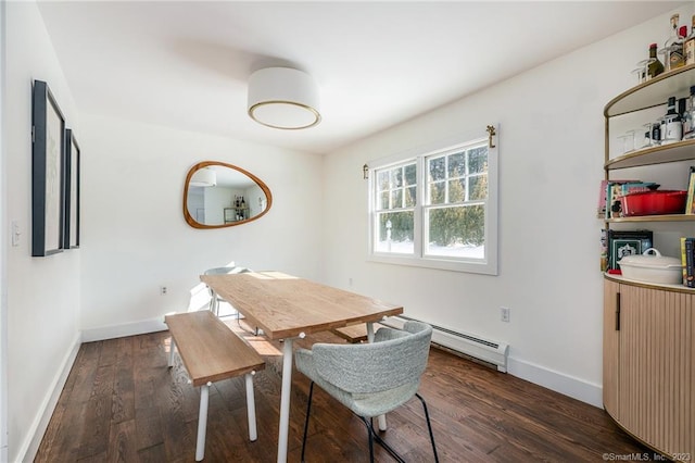 dining space featuring dark wood-type flooring and a baseboard radiator