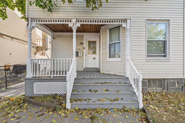 entrance to property featuring a porch