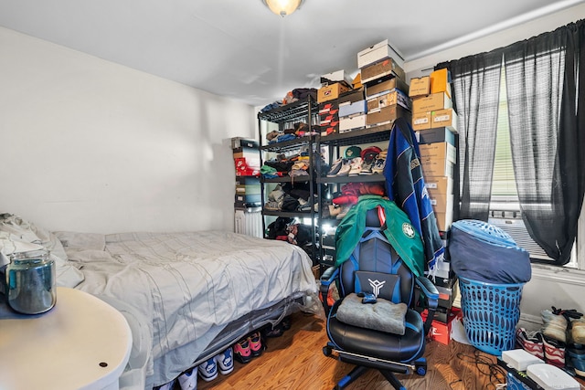 bedroom with wood-type flooring