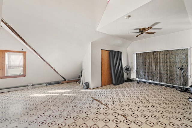 interior space featuring ceiling fan and vaulted ceiling