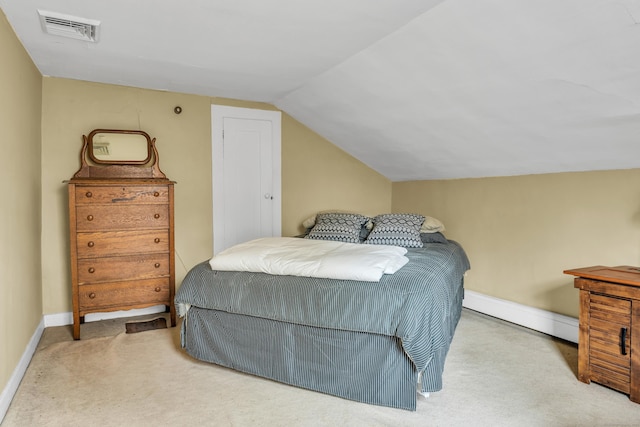 bedroom with carpet flooring, visible vents, baseboards, baseboard heating, and lofted ceiling