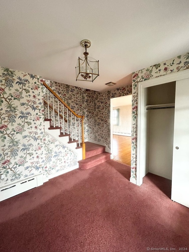 interior space featuring carpet floors and baseboard heating