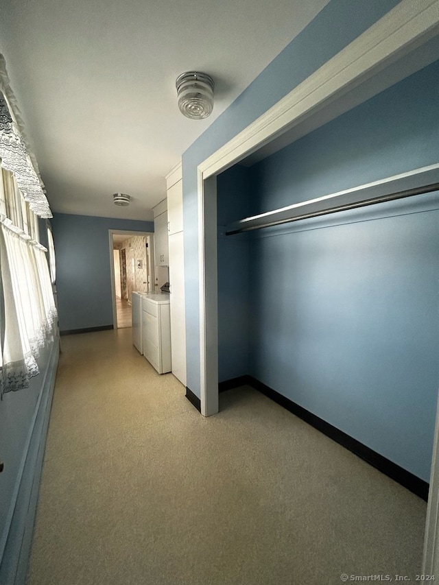 interior space with washer and clothes dryer